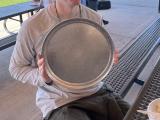 My holding a pizza plate.